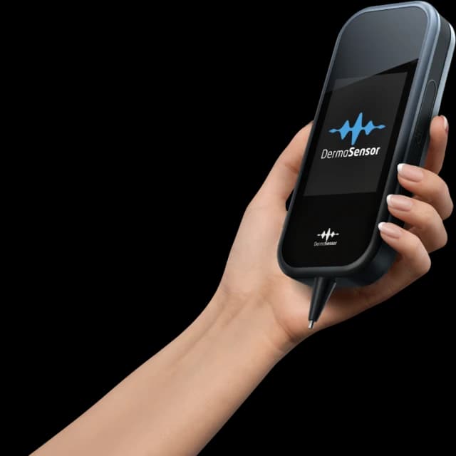 Person holding DermaSensor skin cancer detection device